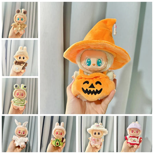 A 17cm Labubu plush doll wearing a custom kawaii pumpkin outfit and matching orange hat
